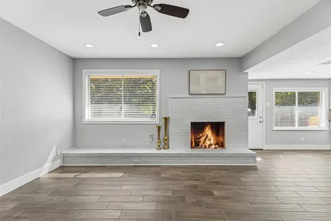 a living room with a fireplace and a window