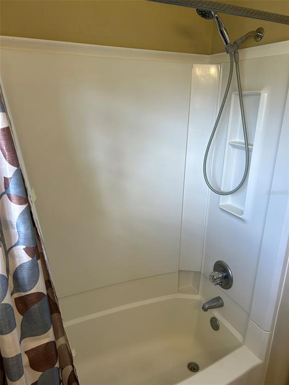 3424 Unity Tree Drive Edgewater, FL 32141 - Photo 25 of 34 a bathroom with a bath tub and shower