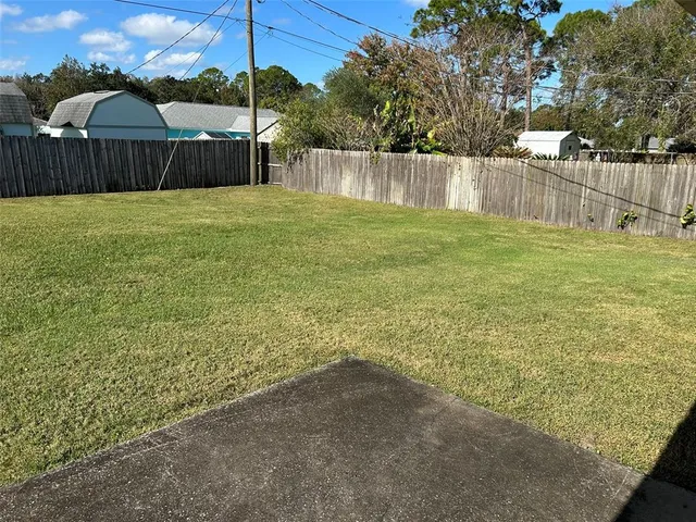 a view of swimming pool with a yard