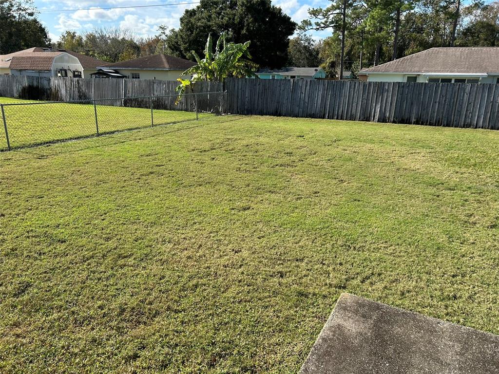 3424 Unity Tree Drive Edgewater, FL 32141 - Photo 27 of 34 a view of a backyard with a fence