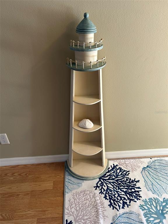 3424 Unity Tree Drive Edgewater, FL 32141 - Photo 28 of 34 a view of a room with wooden floor and cabinet