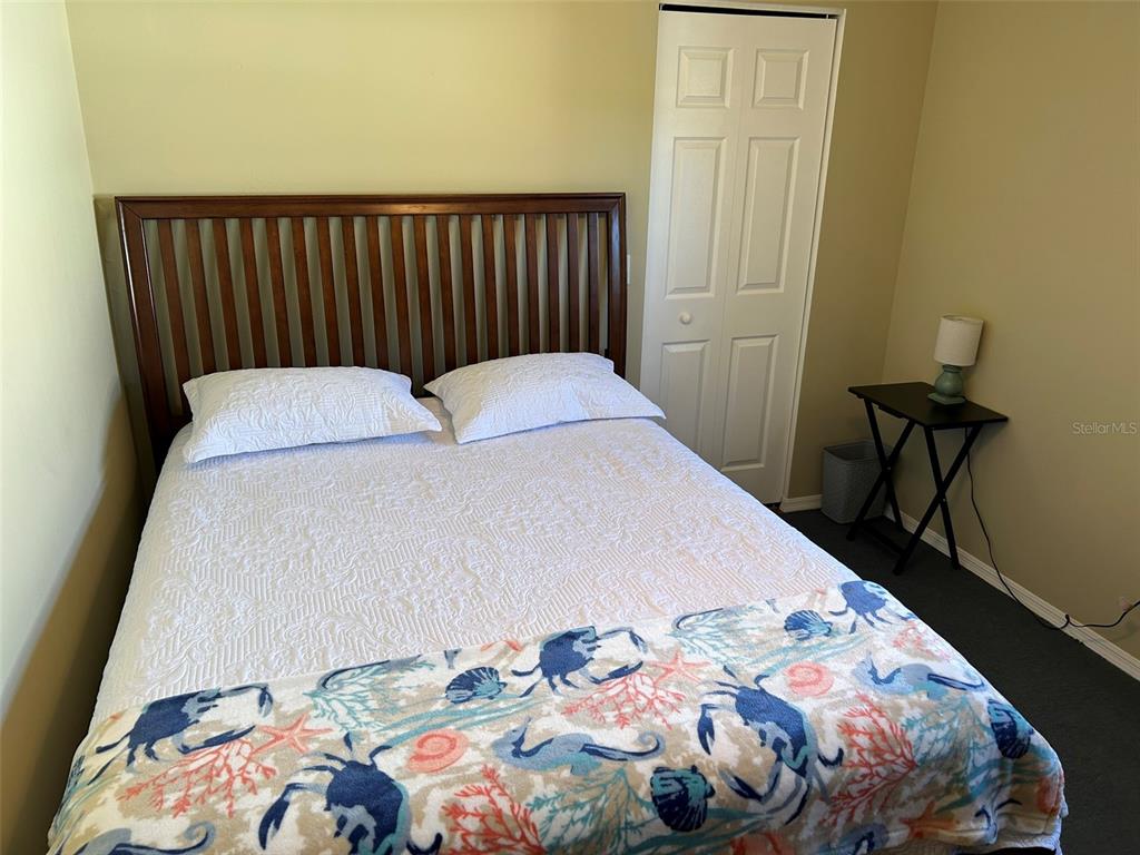 3424 Unity Tree Drive Edgewater, FL 32141 - Photo 5 of 34 a bedroom with a bed and a window
