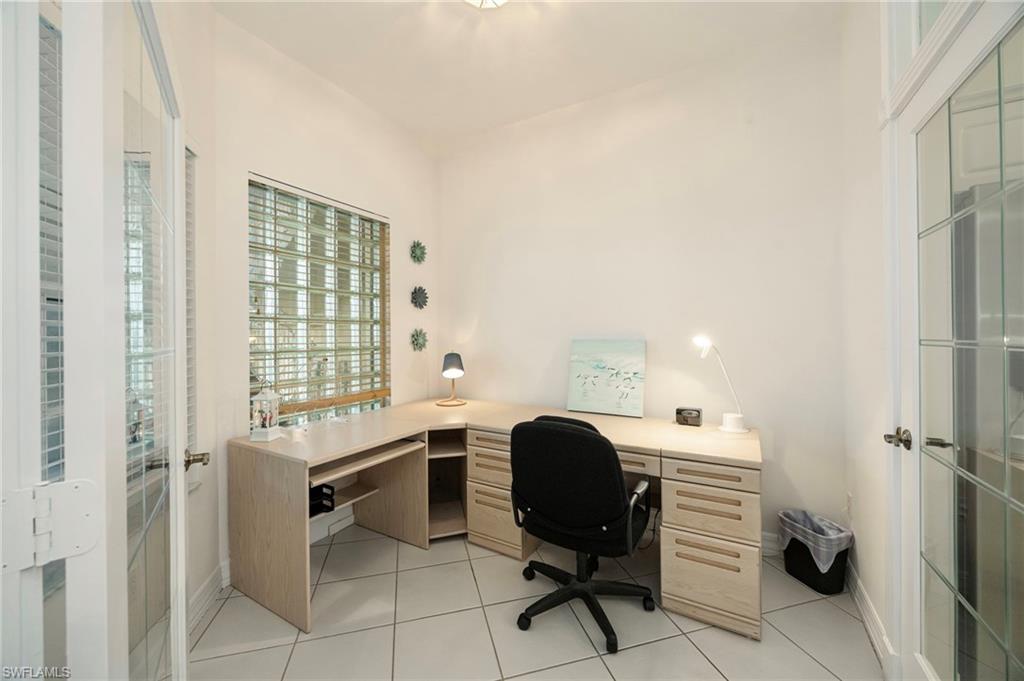 410 Bayfront Place, Unit 2502 Naples, FL 34102 - Photo 11 of 21 a view of a workspace with furniture and a window