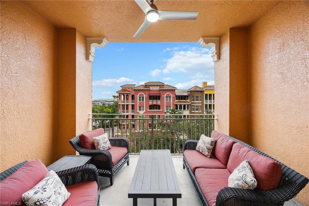 410 Bayfront Place, Unit 2502 Naples, FL 34102 - Photo 12 of 21 a balcony with furniture and a floor to ceiling window