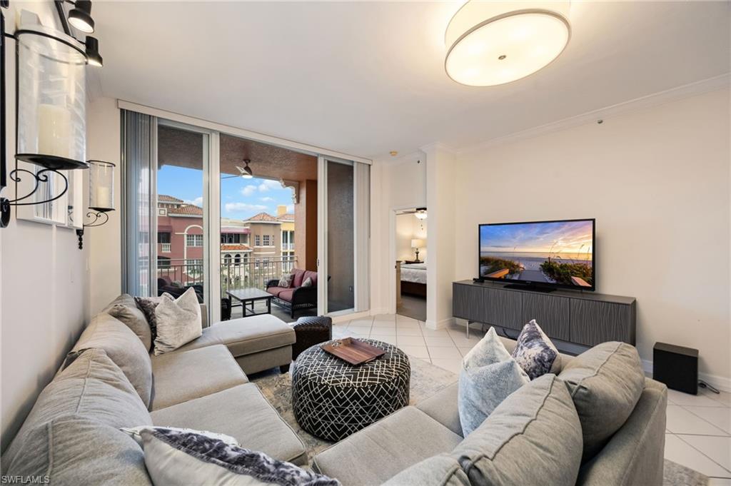 410 Bayfront Place, Unit 2502 Naples, FL 34102 - Photo 2 of 21 a living room with furniture and a flat screen tv