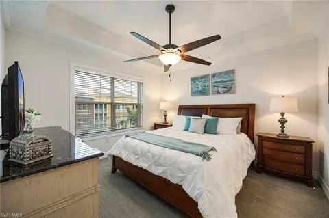 a bedroom with bed and a window