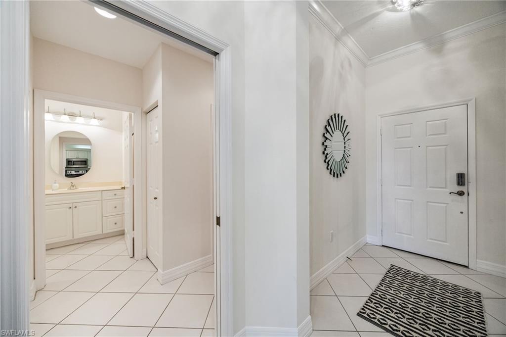 410 Bayfront Place, Unit 2502 Naples, FL 34102 - Photo 8 of 21 a bathroom with a shower and mirror