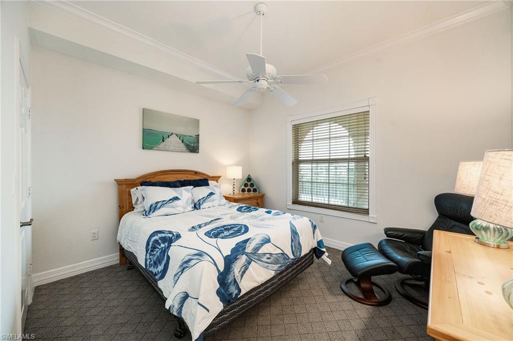 410 Bayfront Place, Unit 2502 Naples, FL 34102 - Photo 9 of 21 a bedroom with a bed furniture and a window