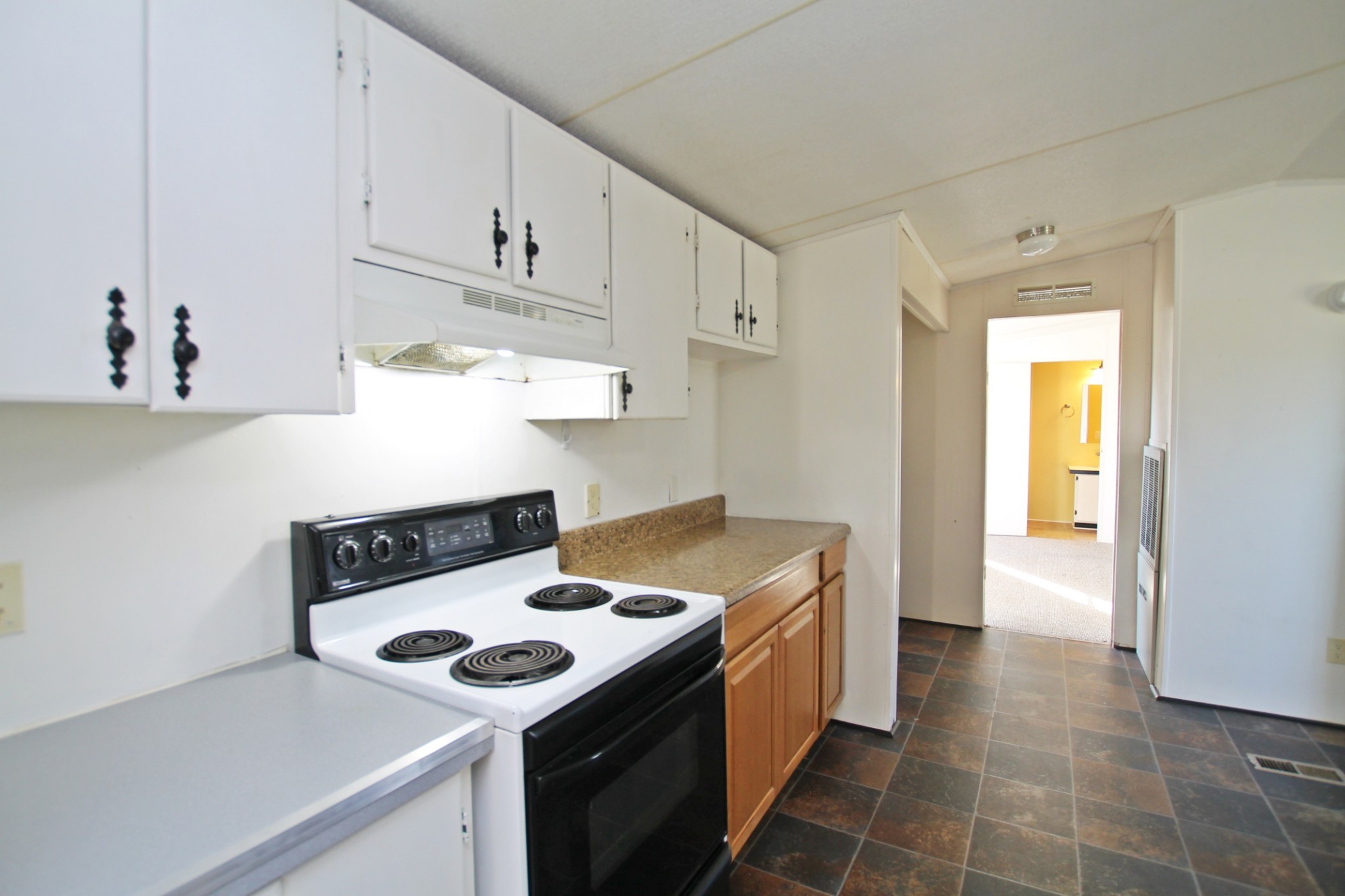 5652 Hopewell Road Springfield, TN 37172 - Photo 12 of 37 a kitchen with a stove and a white cabinets