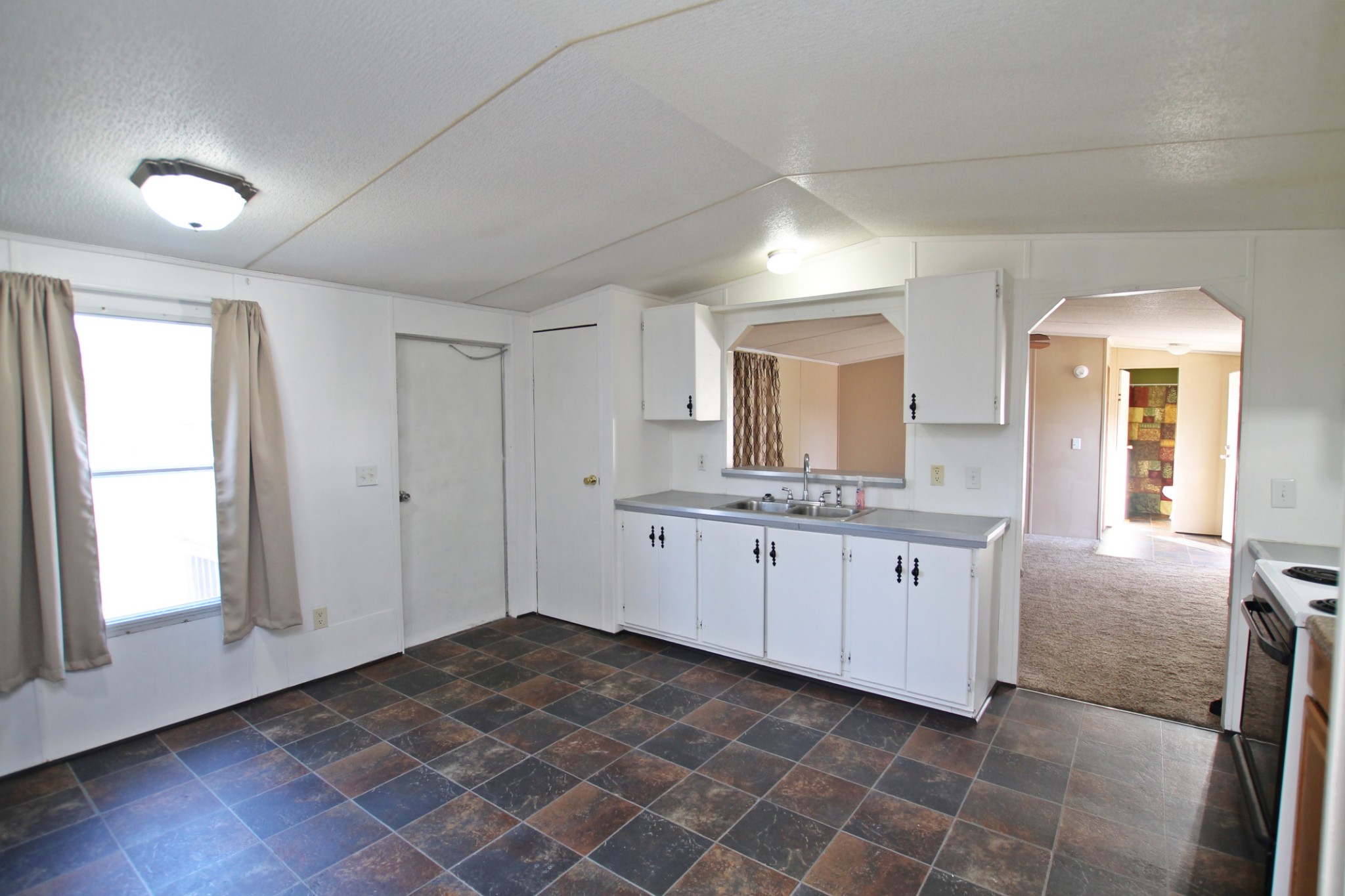 5652 Hopewell Road Springfield, TN 37172 - Photo 13 of 37 a room with granite countertop white cabinets and window