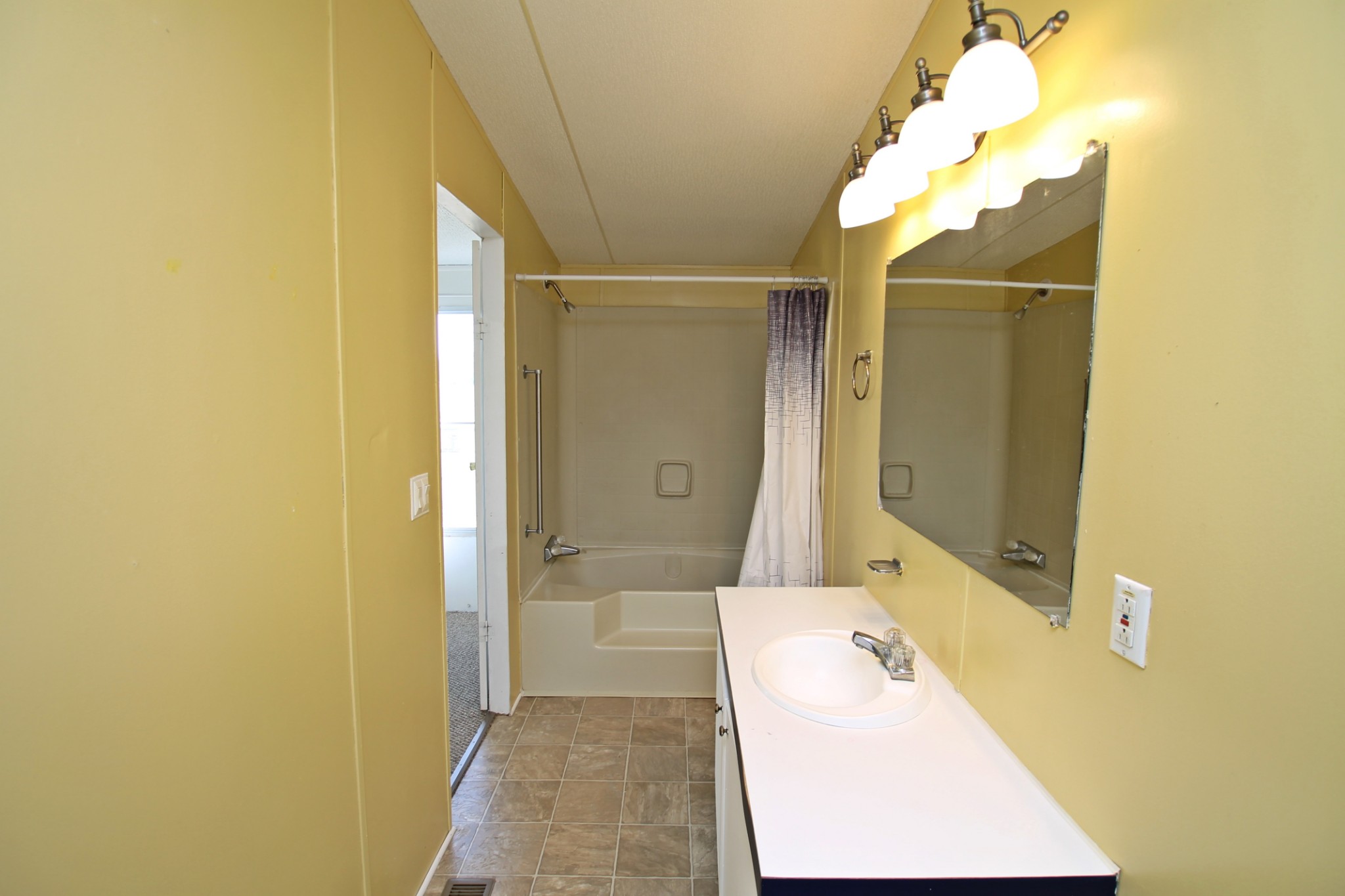 5652 Hopewell Road Springfield, TN 37172 - Photo 18 of 37 a bathroom with a tub shower vanity and a sink