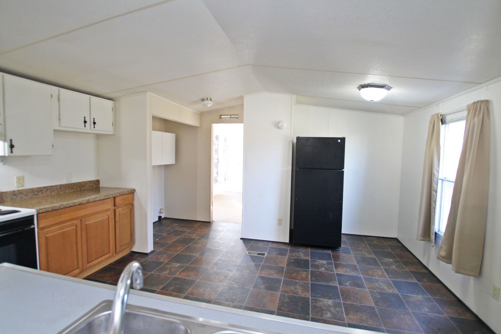 5652 Hopewell Road Springfield, TN 37172 - Photo 10 of 37 a view of a kitchen with refrigerator and cabinet