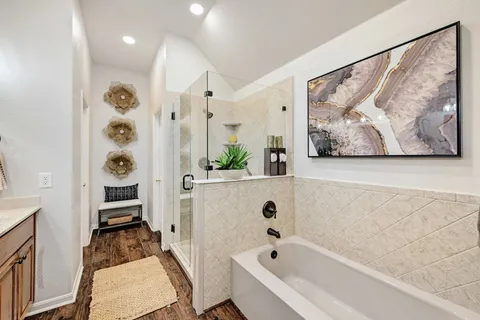 a bathroom with a bathtub and a shower