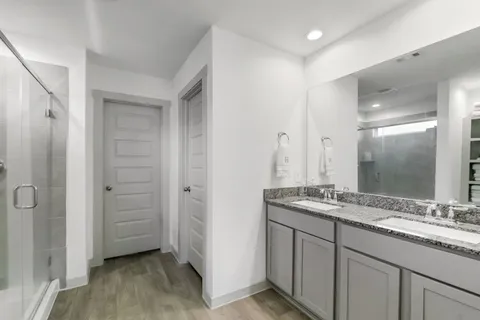 a bathroom with a bathtub and a shower