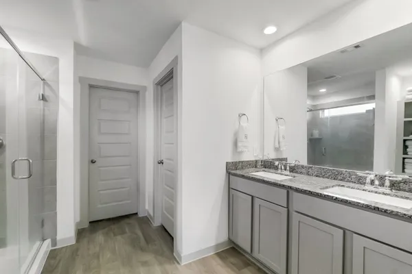 a bathroom with a bathtub and a shower