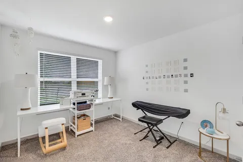 a view of a workspace with furniture