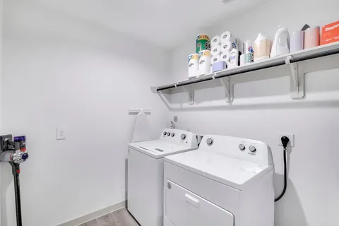 a view of a porch with chairs and a potted plant