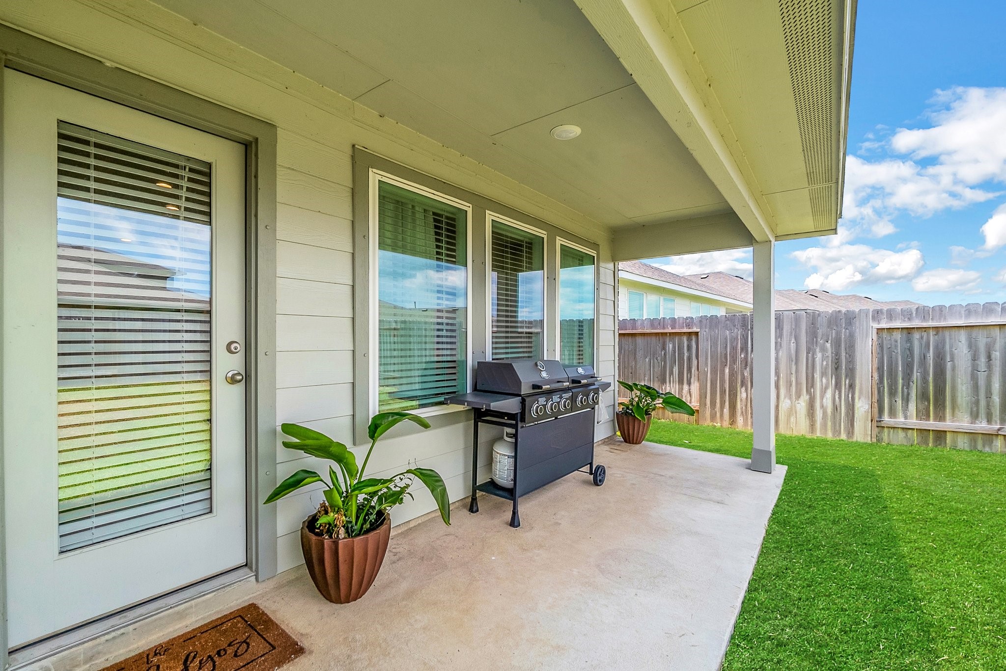 10647 Cascade Crk Drive Rosharon, TX 77583 - Photo 19 of 27 a view of a porch with chairs and a potted plant