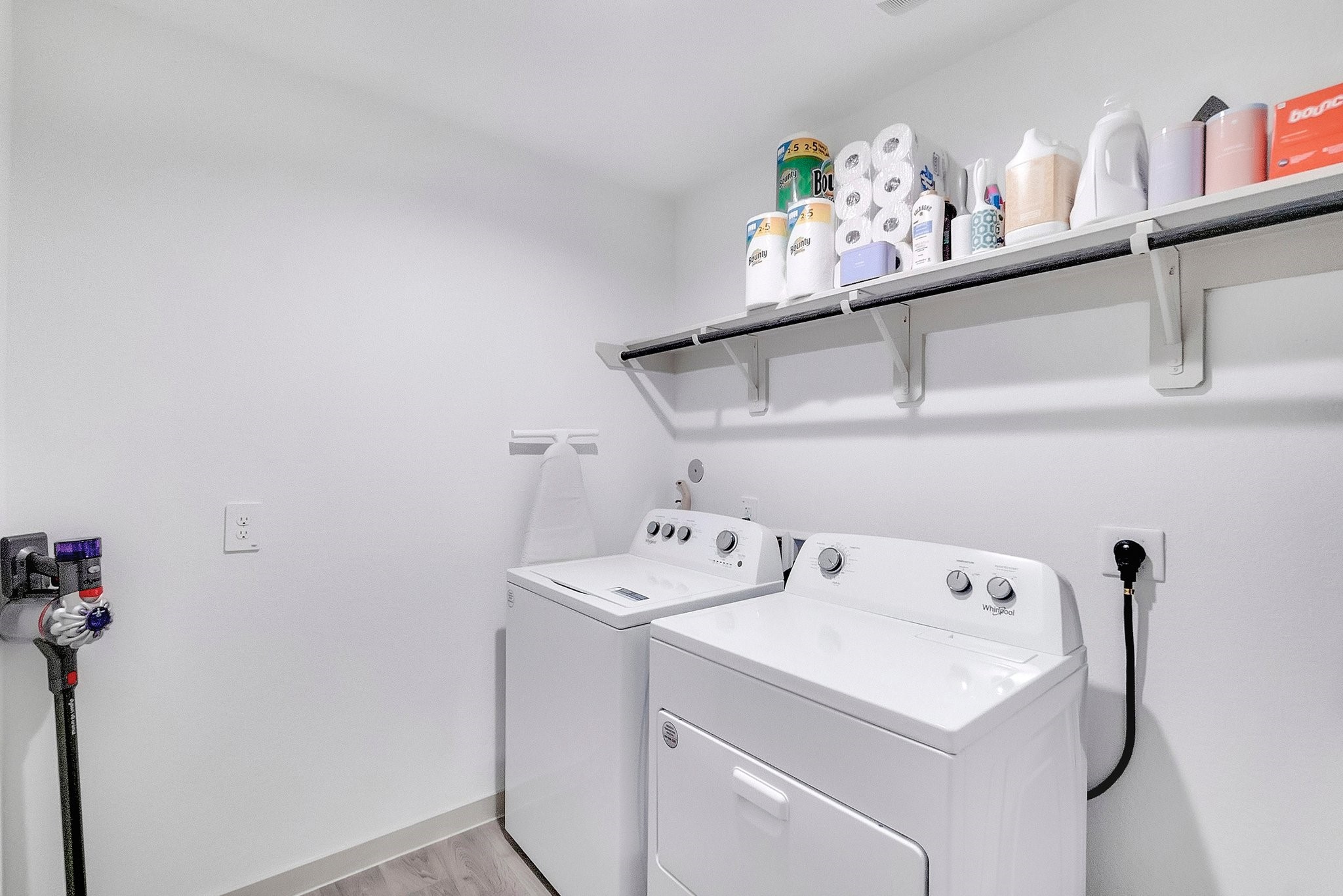 10647 Cascade Crk Drive Rosharon, TX 77583 - Photo 18 of 29 Laundry room strategically placed in the center of the home for convenience and efficiency, a nice walk-in space