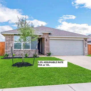 a kitchen with stainless steel appliances kitchen island granite countertop a refrigerator and a stove top oven