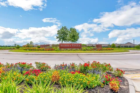a view of a golf course with a big yard