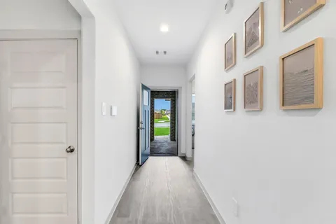 a kitchen with stainless steel appliances kitchen island granite countertop a refrigerator and a stove top oven