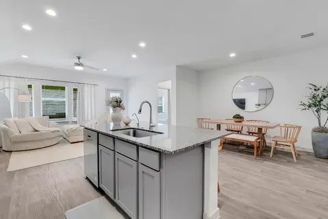 a livingroom with workspace and a window