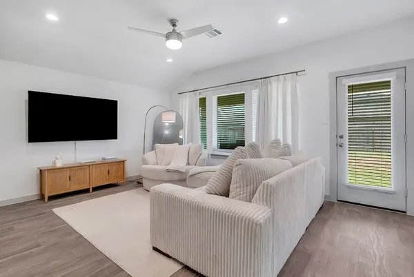 a living room with furniture and a large window