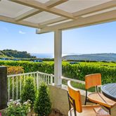 a view of a chair and table in the balcony