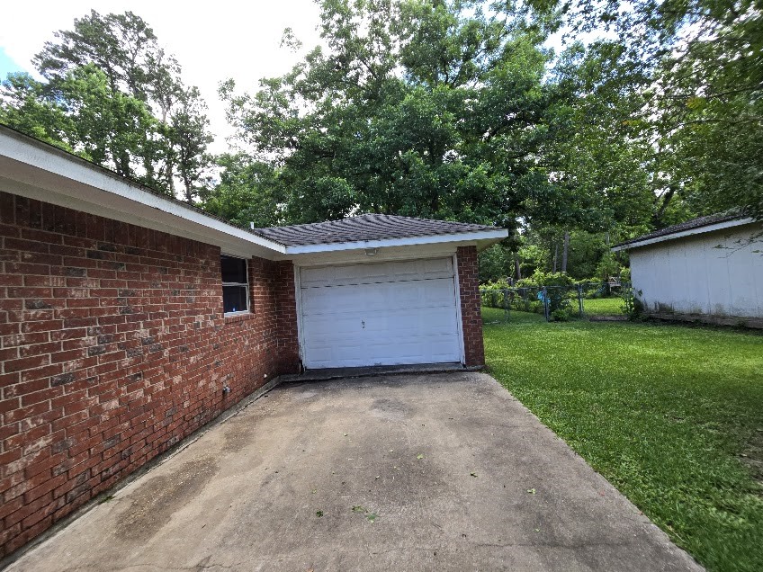 509 Bobcat Lane Daisetta, TX 77533 - Photo 24 of 26 a front view of house with yard and trees