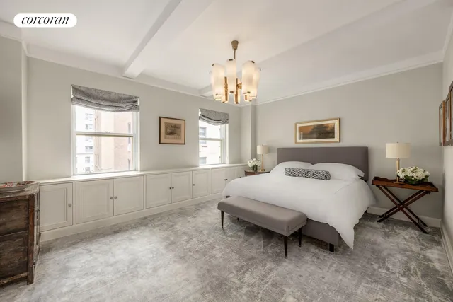 a spacious bedroom with a bed and a window