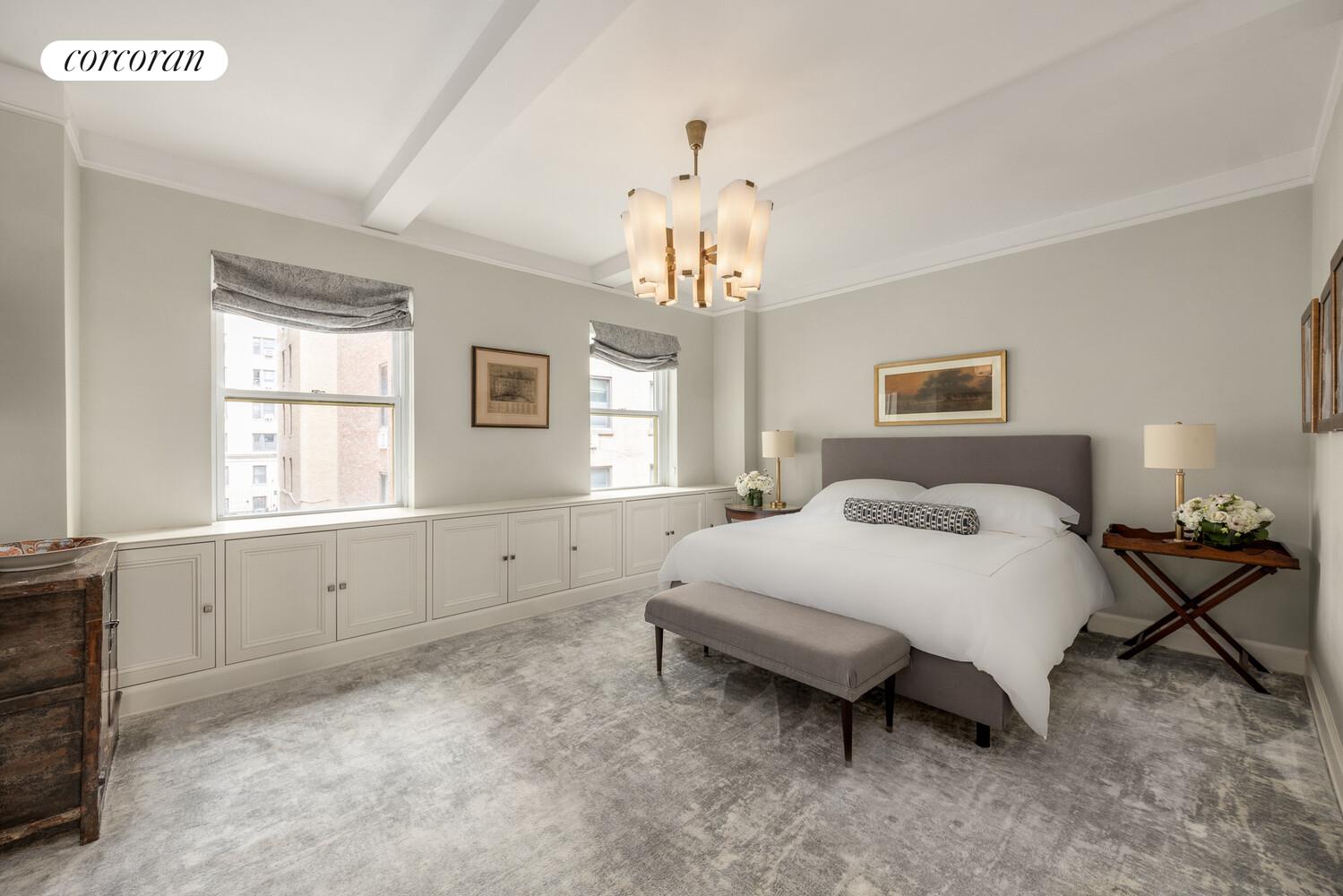 3 East 84th Street, Unit 3 Manhattan, NY 10028 - Photo 16 of 24 a spacious bedroom with a bed and a window