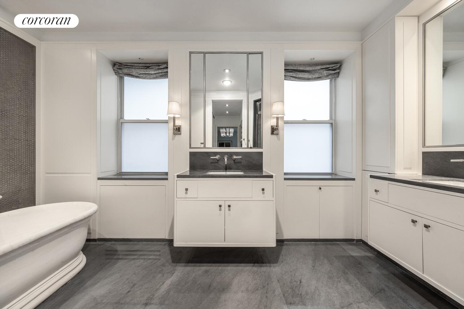 3 East 84th Street, Unit 3 Manhattan, NY 10028 - Photo 17 of 24 a bathroom with a sink and a mirror