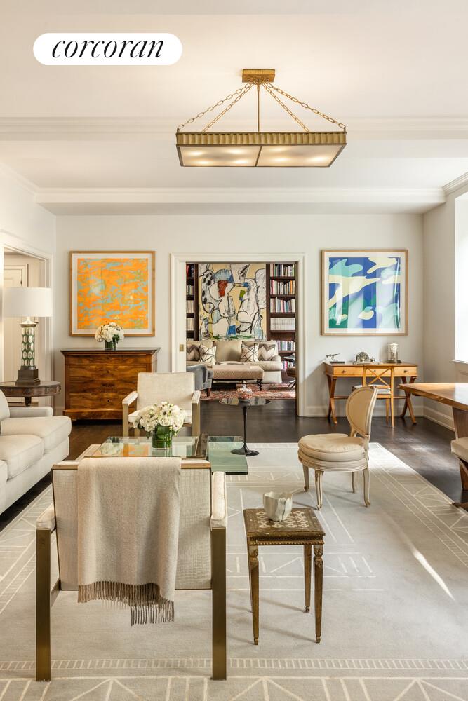 3 East 84th Street, Unit 3 Manhattan, NY 10028 - Photo 5 of 24 a living room with fireplace furniture and a large window