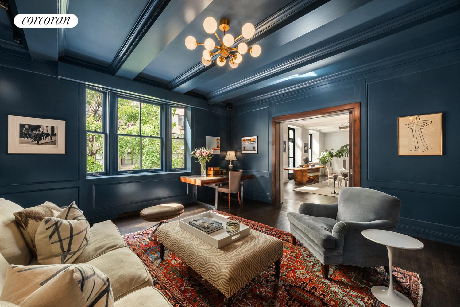 3 East 84th Street, Unit 3 Manhattan, NY 10028 - Photo 8 of 24 a living room with furniture and a large window