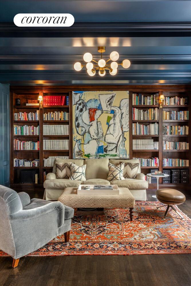3 East 84th Street, Unit 3 Manhattan, NY 10028 - Photo 9 of 24 a living room with furniture and a floor to ceiling window next to a large window