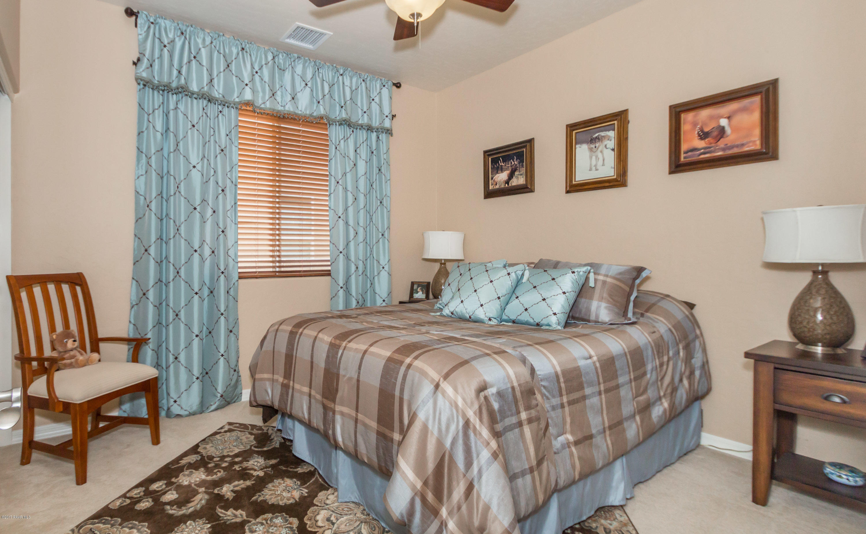 1197 Rusty Nail Road Prescott Valley, AZ 86314 - Photo 11 of 40 a bedroom with bed and a window