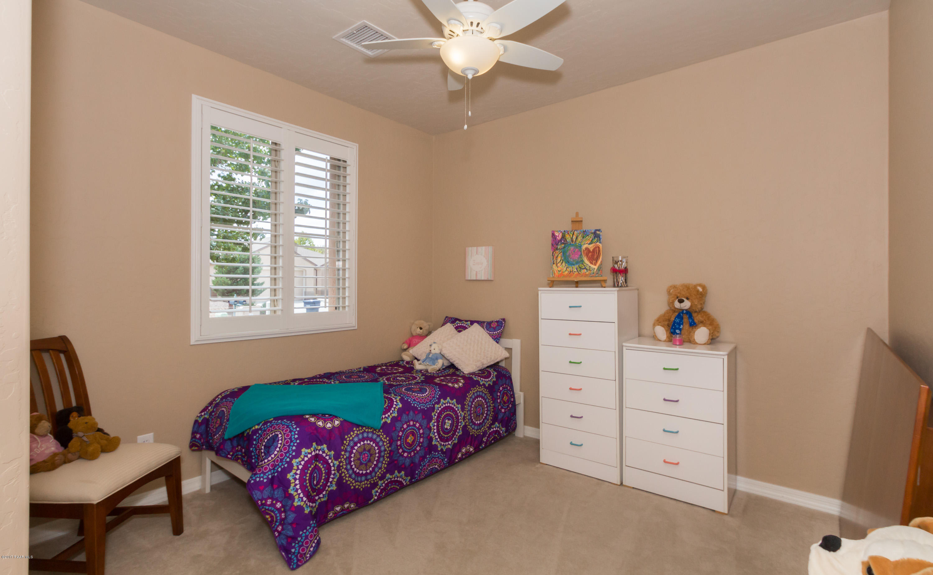 1197 Rusty Nail Road Prescott Valley, AZ 86314 - Photo 13 of 40 a bedroom with a bed and a window
