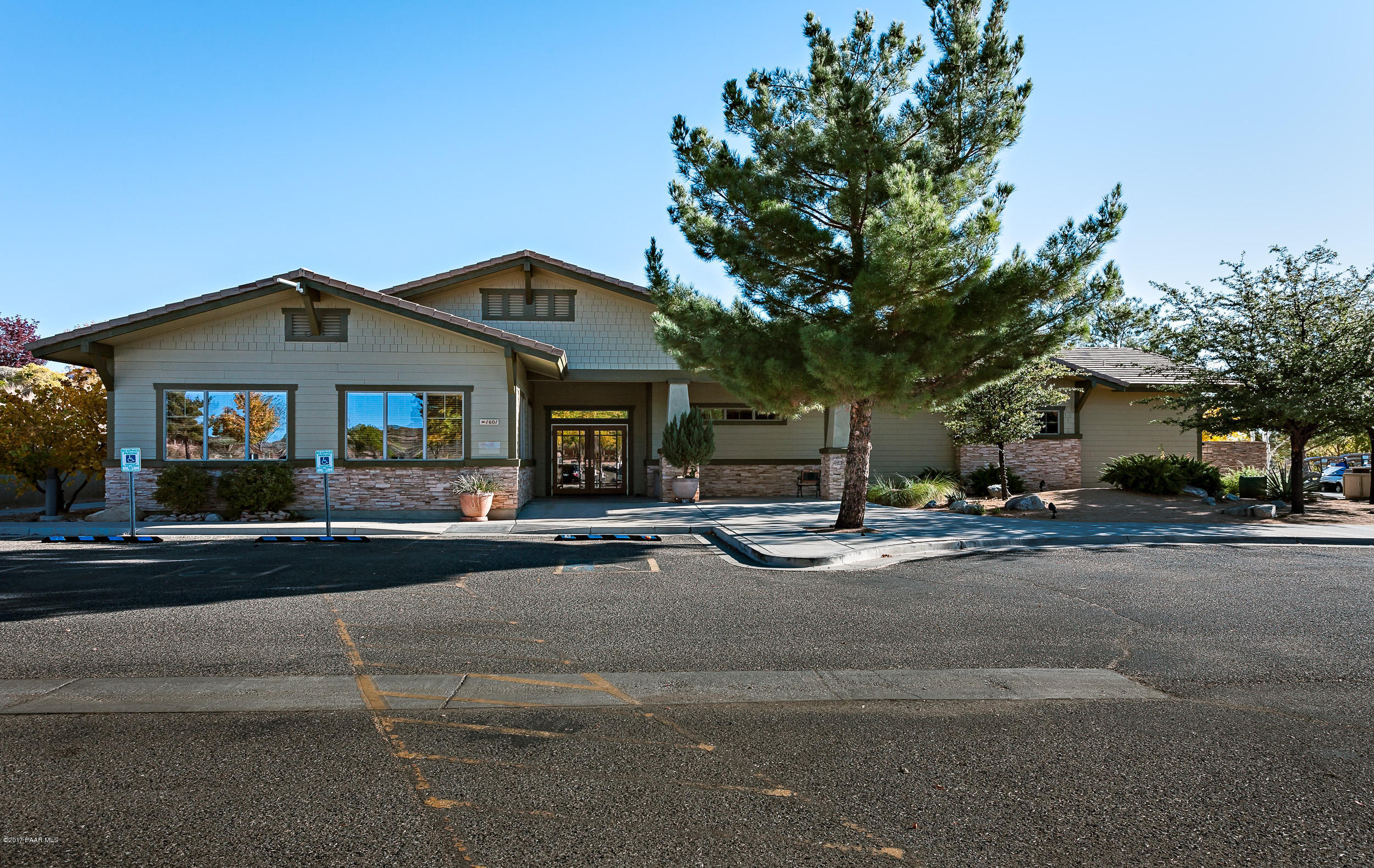 1197 Rusty Nail Road Prescott Valley, AZ 86314 - Photo 19 of 40 a front view of a house with a garden and parking
