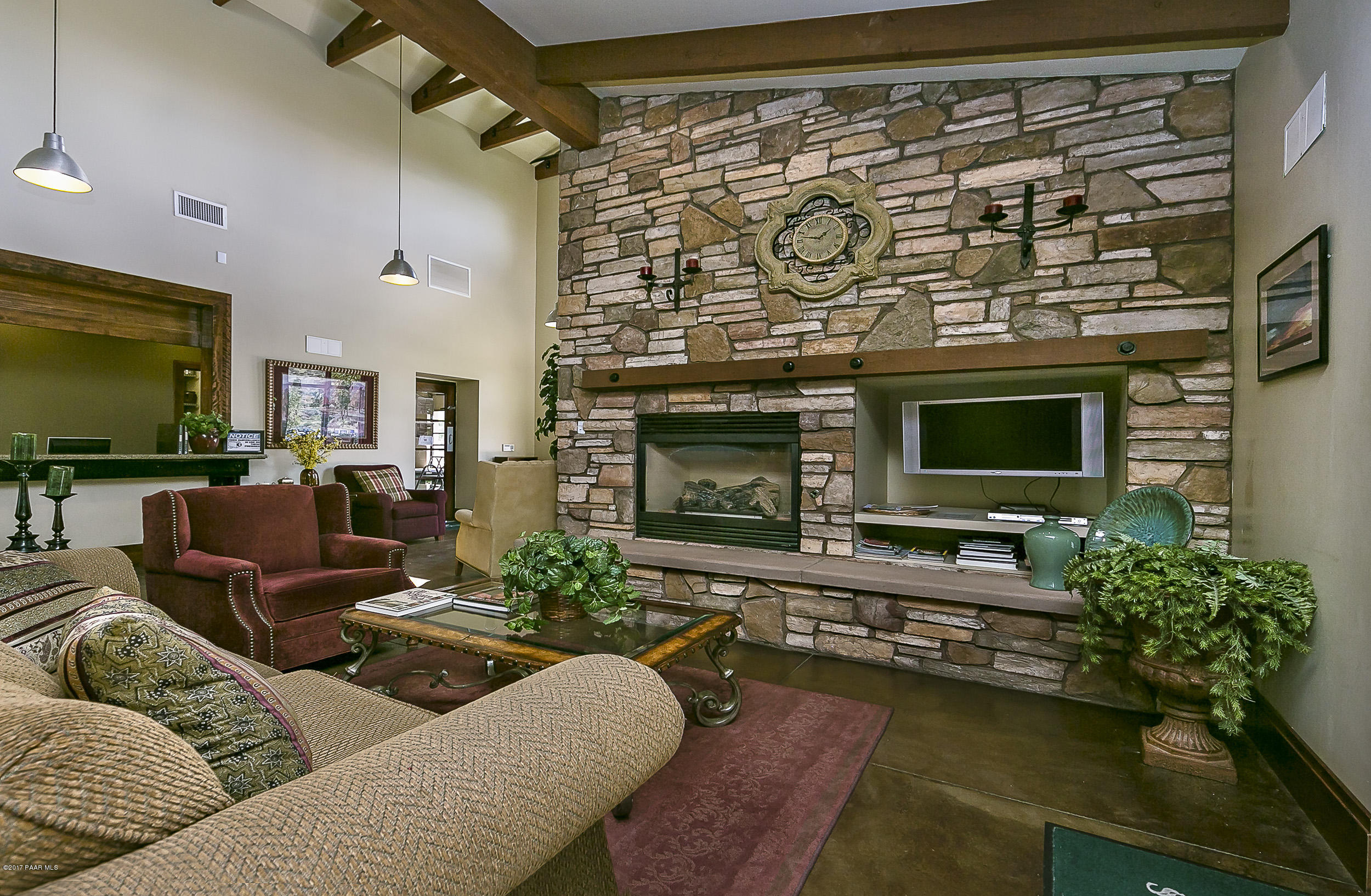 1197 Rusty Nail Road Prescott Valley, AZ 86314 - Photo 20 of 40 a living room with furniture flat screen tv and a fireplace