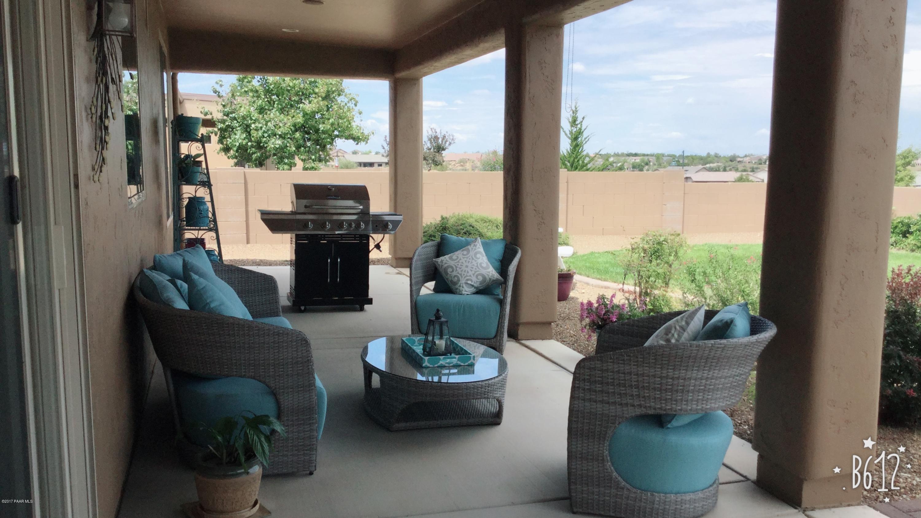 1197 Rusty Nail Road Prescott Valley, AZ 86314 - Photo 33 of 40 a living room with furniture and a potted plant