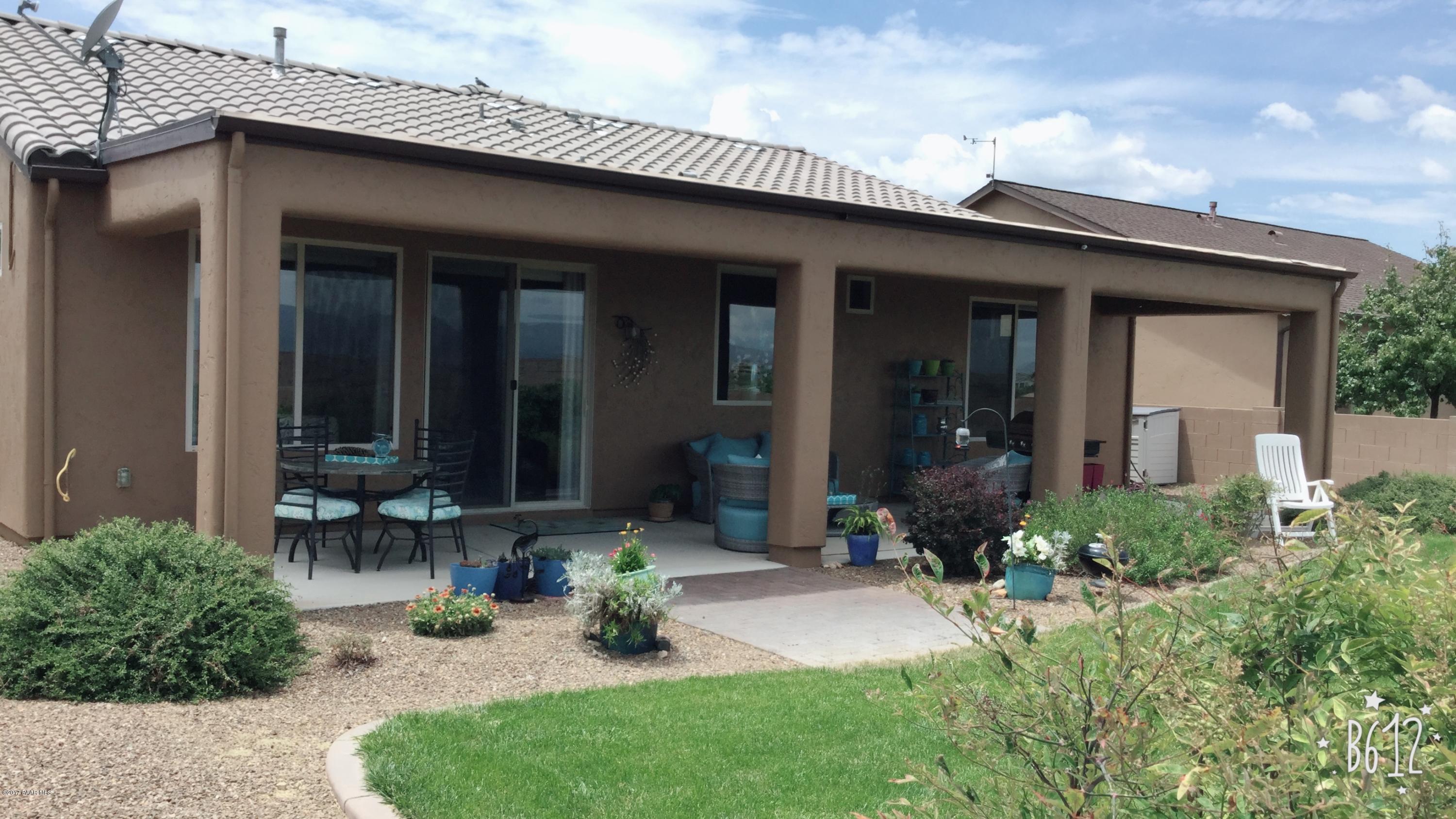 1197 Rusty Nail Road Prescott Valley, AZ 86314 - Photo 34 of 40 a front view of a house with a yard