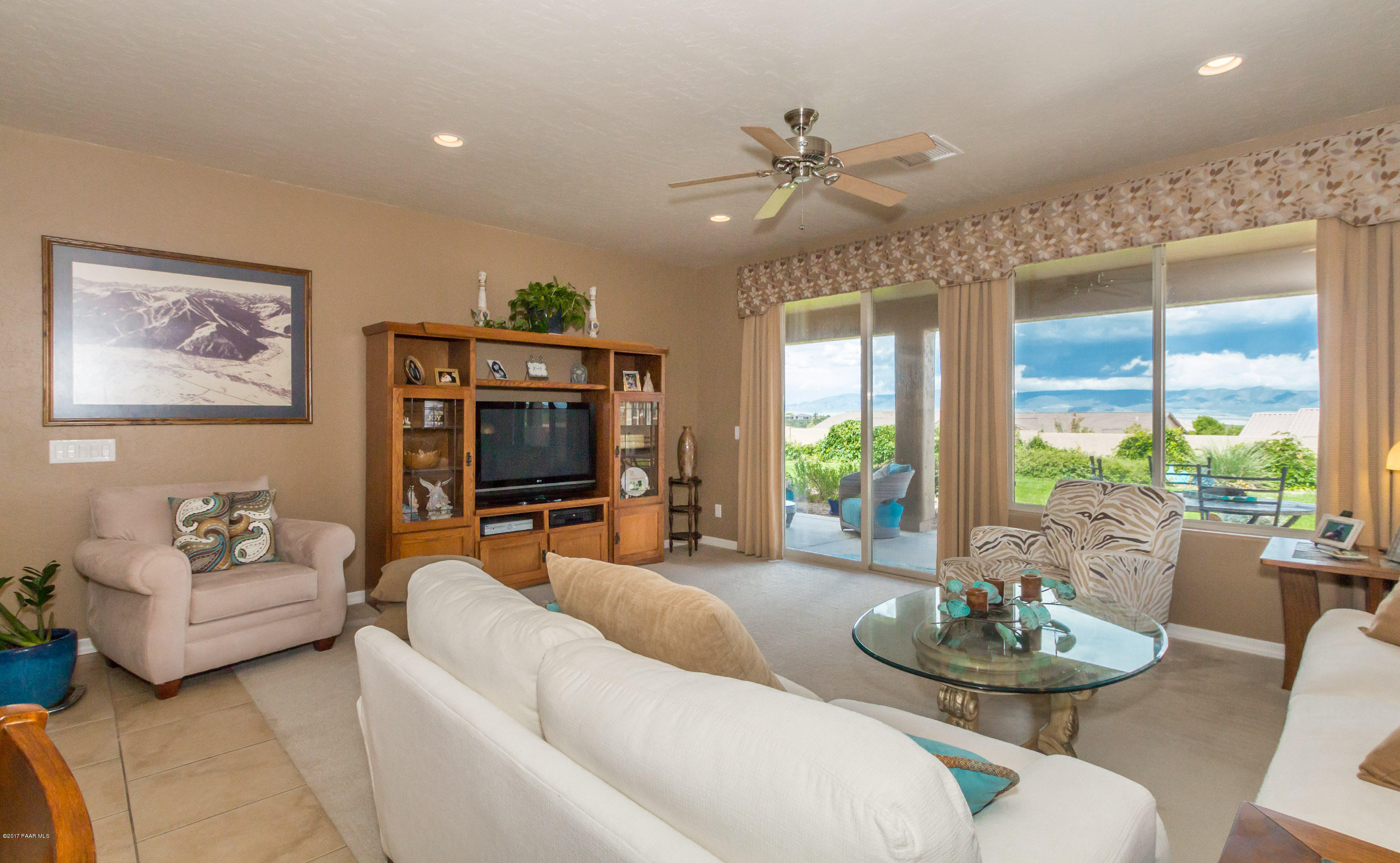 1197 Rusty Nail Road Prescott Valley, AZ 86314 - Photo 5 of 40 a living room with furniture and a flat screen tv