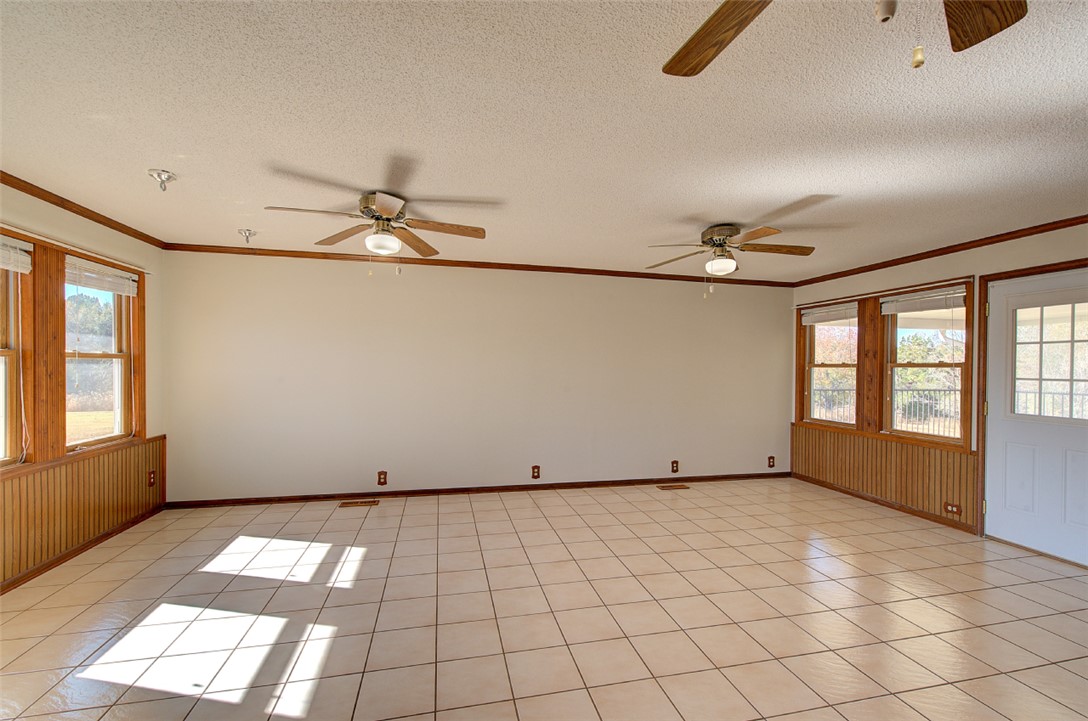 130 Raleighs Lane West Union, SC 29696 - Photo 14 of 49 Tiled flooring and natural wood trim define this versatile, light-filled living space.