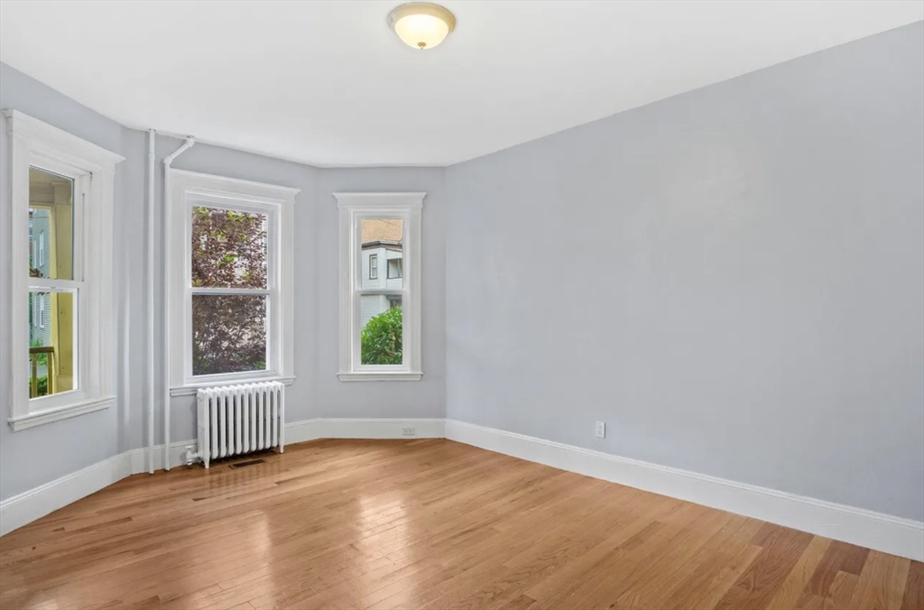 52 Intervale Street Boston, MA 02121 - Photo 12 of 16 an empty room with a window