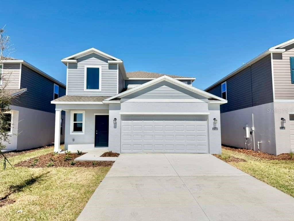 2764 Lookout Rdg Road Haines City, FL 33844 - Photo 1 of 21 a front view of a house with a yard