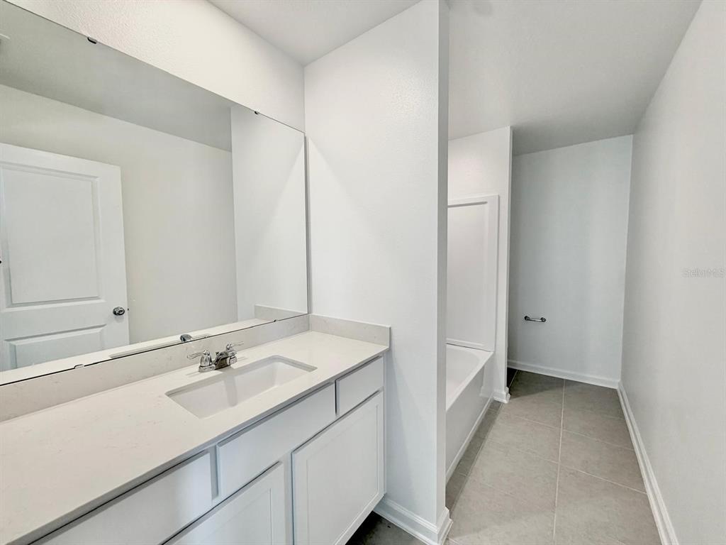 2764 Lookout Rdg Road Haines City, FL 33844 - Photo 17 of 21 a bathroom with a sink and a mirror