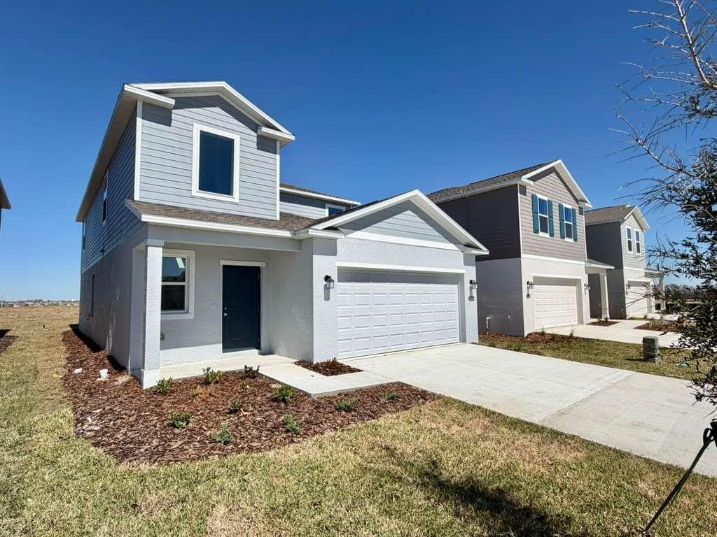 2764 Lookout Rdg Road Haines City, FL 33844 - Photo 3 of 21 a front view of a house with a yard