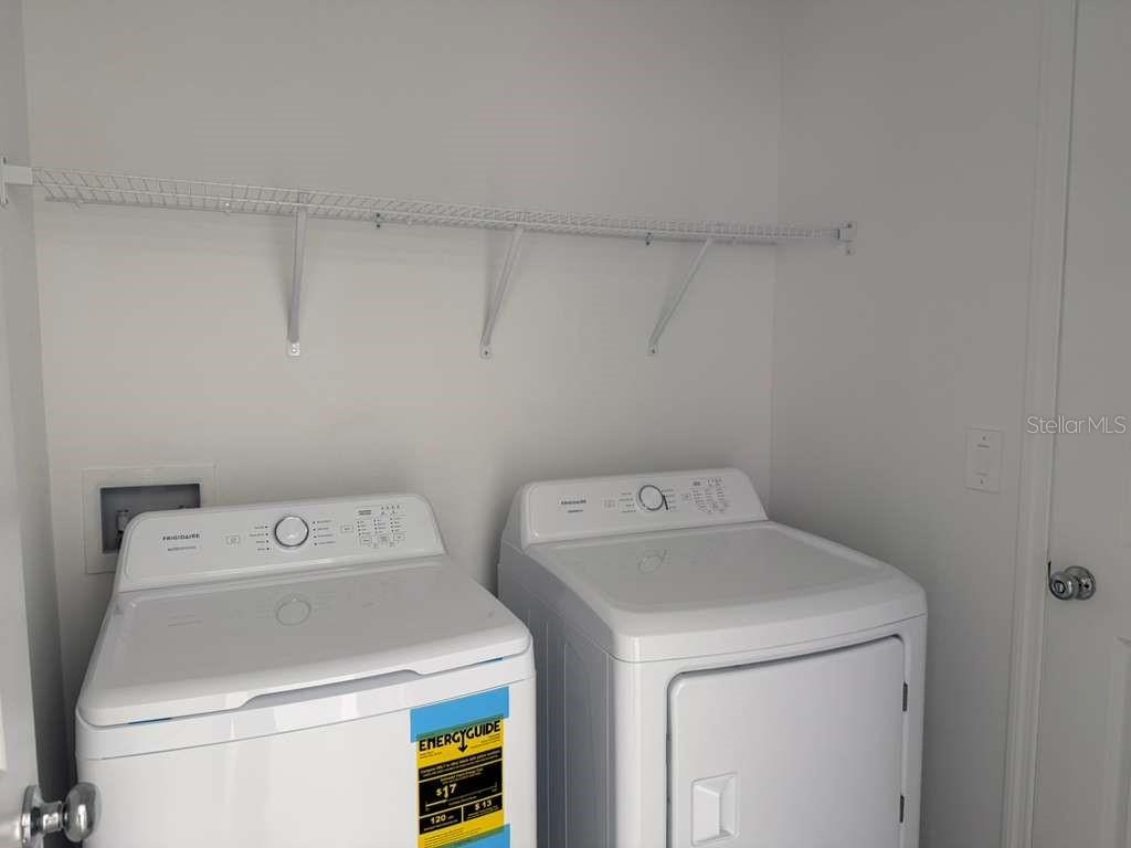 2764 Lookout Rdg Road Haines City, FL 33844 - Photo 8 of 21 a utility room with dryer and washer