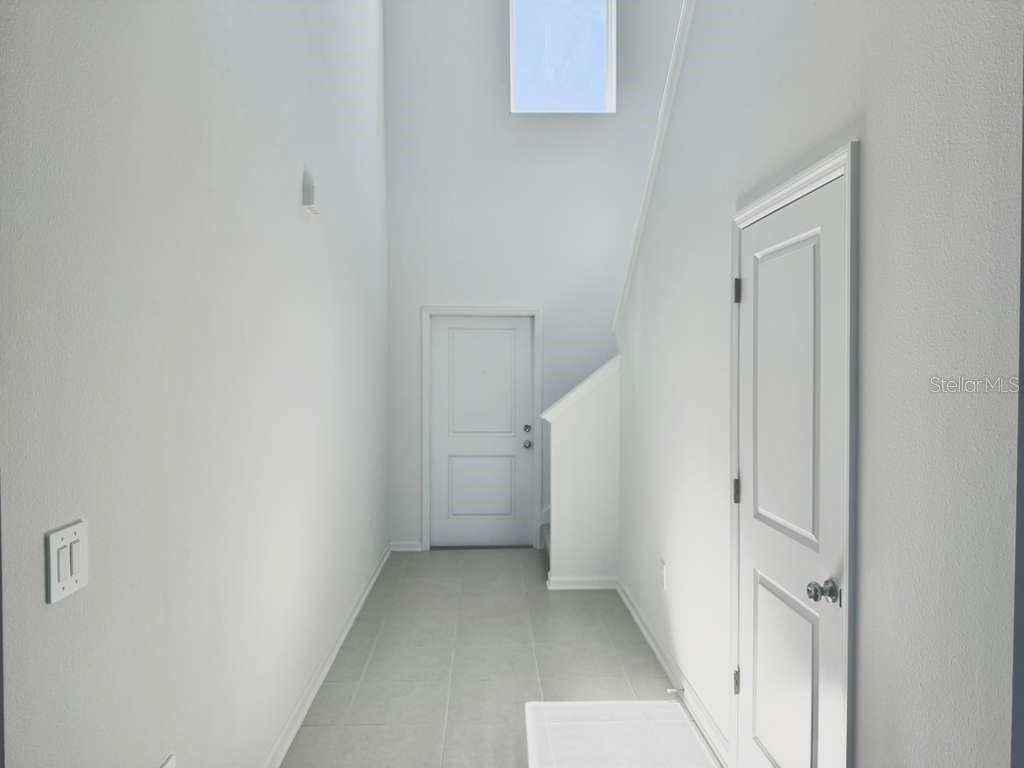 2764 Lookout Rdg Road Haines City, FL 33844 - Photo 9 of 21 a view of a hallway with white walls and a white door